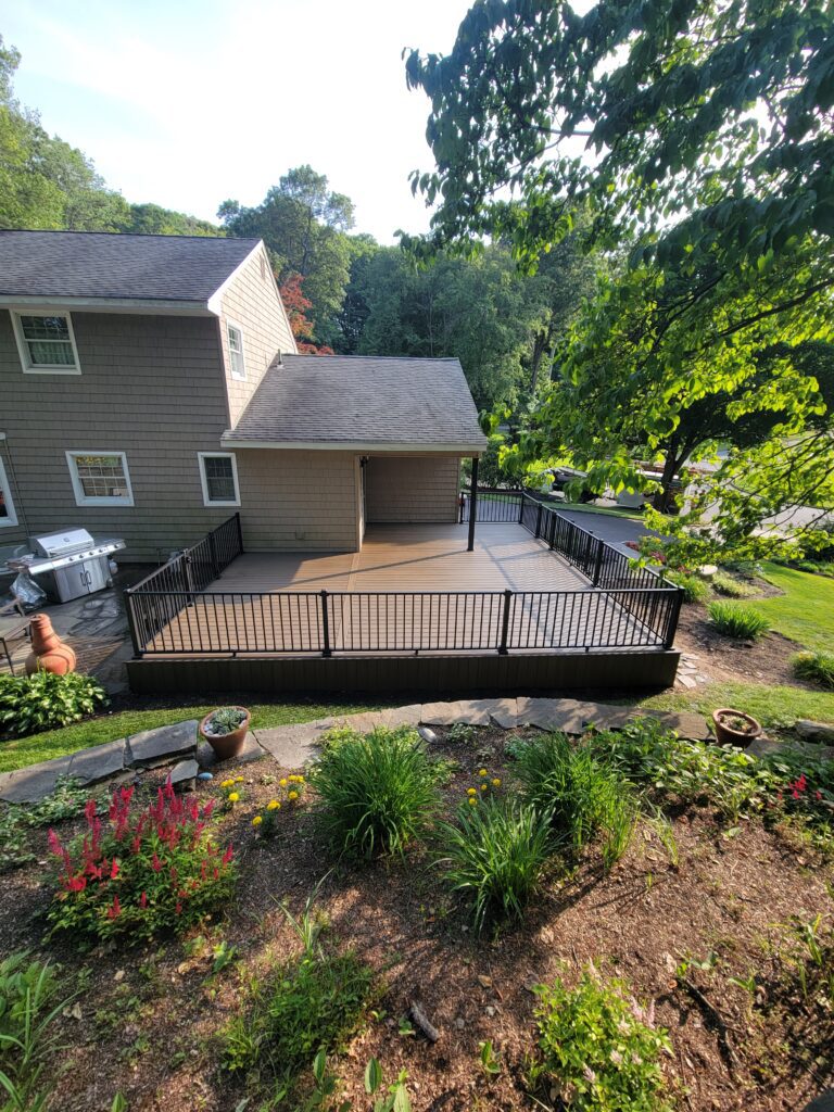 Eco-friendly decking materials - Decks by Decker Elevated deck by Deck Builder in Lake Grove, NY